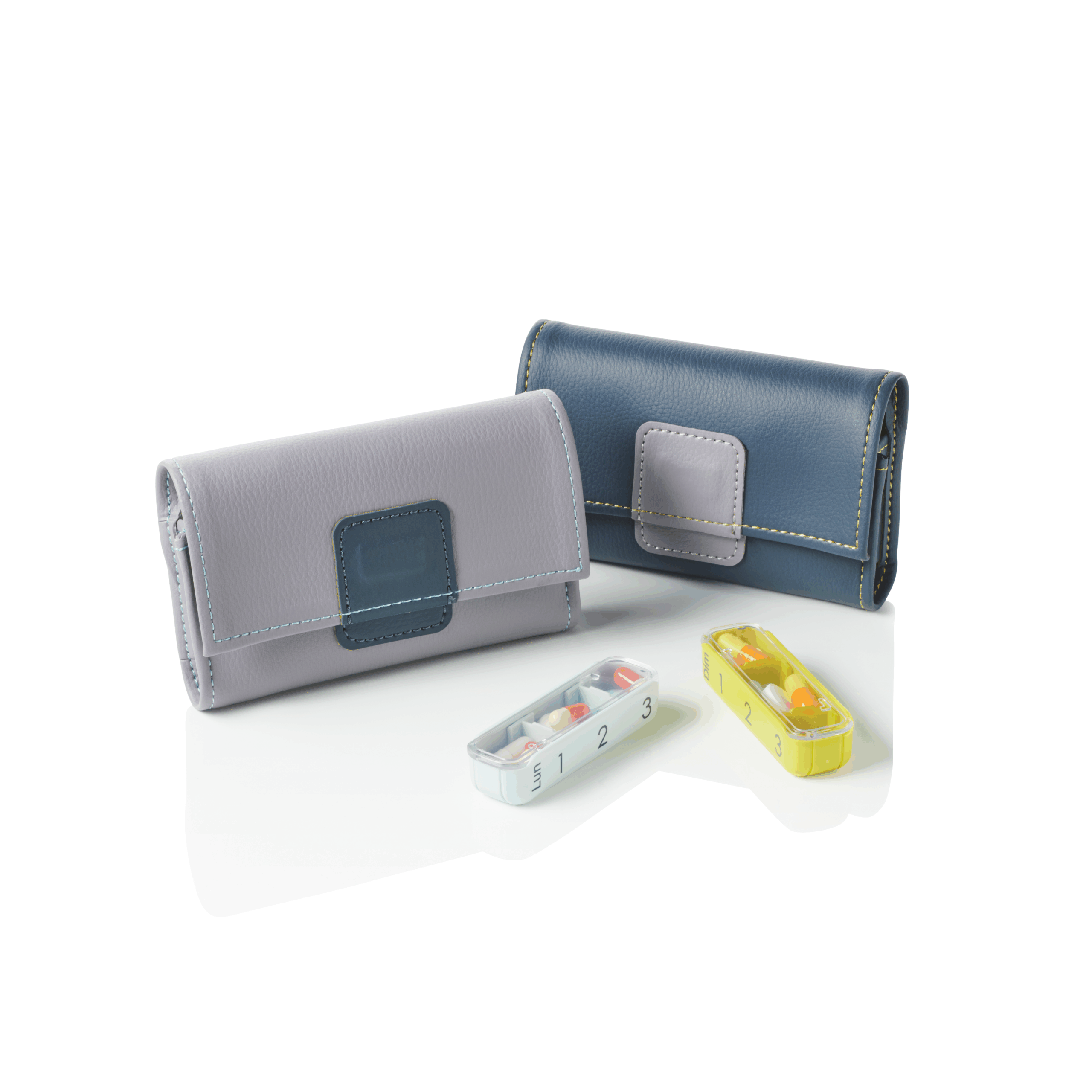 Pilbox Mini gris et gris clair fermés avec module bleu clair et jaune devant remplis de gélules